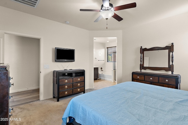 3326 N 31st St, Mesa, AZ 85213 - bedroom featuring connected bathroom, a ceiling fan, and light colored carpet