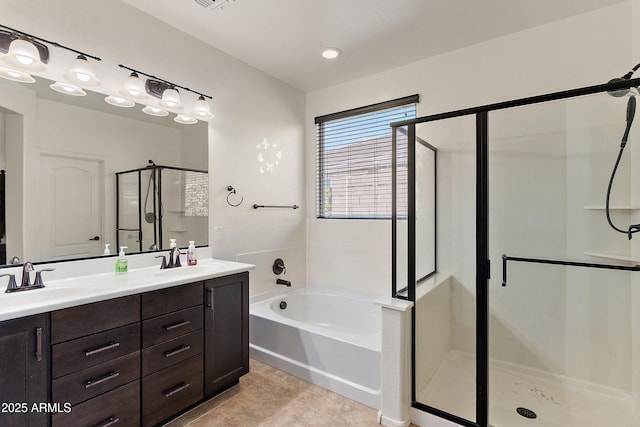 3326 N 31st St, Mesa, AZ 85213 - full bathroom featuring a stall shower, a bath, double vanity, and tile patterned floors