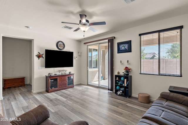 3326 N 31st St, Mesa, AZ 85213 - living room featuring a ceiling fan and light wood-style floors