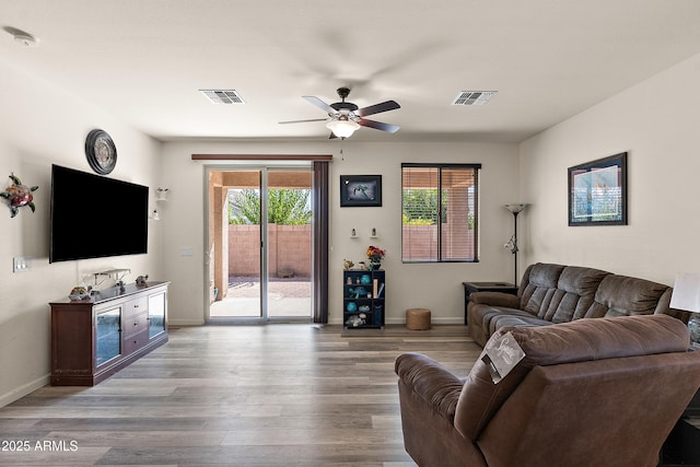 3326 N 31st St, Mesa, AZ 85213 - living area featuring a ceiling fan, plenty of natural light, and wood finished floors