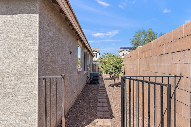 3326 N 31st St, Mesa, AZ 85213 - view of property exterior featuring stucco siding and a central AC unit