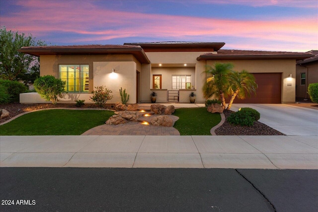 prairie-style house featuring a garage