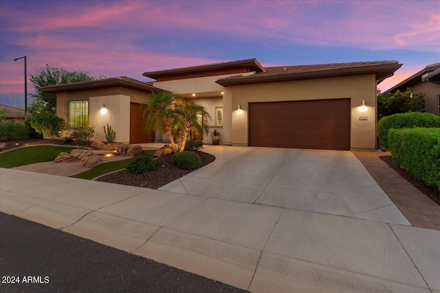 prairie-style house featuring a garage