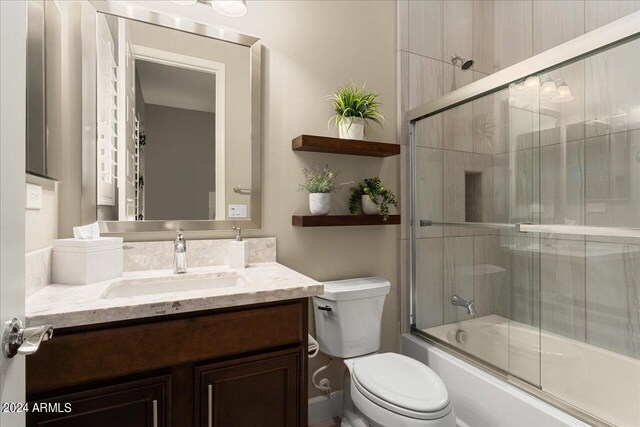 bathroom featuring an enclosed shower