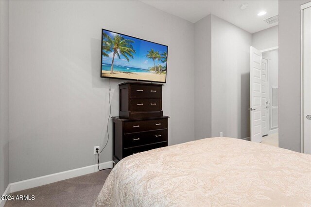 bedroom with ceiling fan and carpet floors