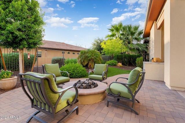 view of patio with an outdoor fire pit