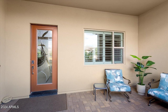 doorway to property with a patio area