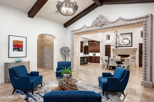 living room with beamed ceiling, high vaulted ceiling, and an inviting chandelier