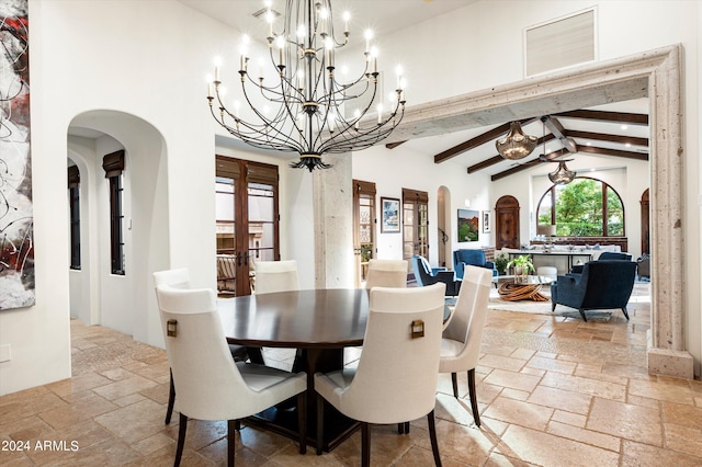 dining space with high vaulted ceiling, a chandelier, and beam ceiling