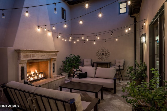 view of patio / terrace with an outdoor living space with a fireplace