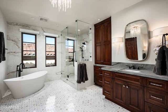 bathroom featuring vanity, tile walls, and separate shower and tub