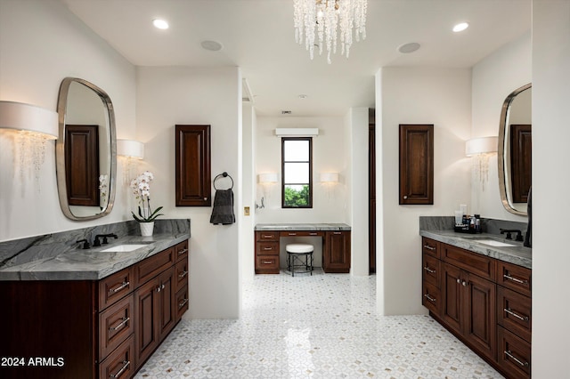 bathroom featuring vanity and a chandelier