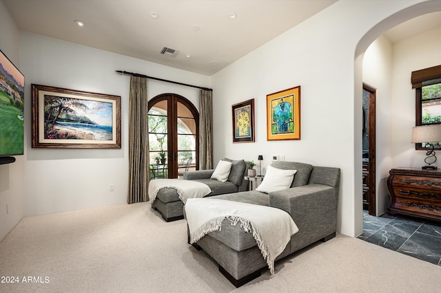 bedroom featuring multiple windows and dark colored carpet