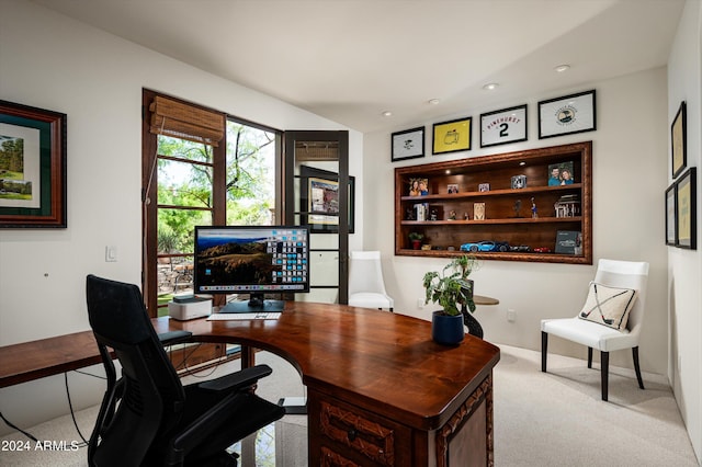 office area featuring light carpet