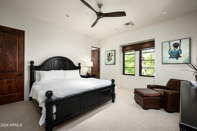 bedroom featuring light carpet and ceiling fan