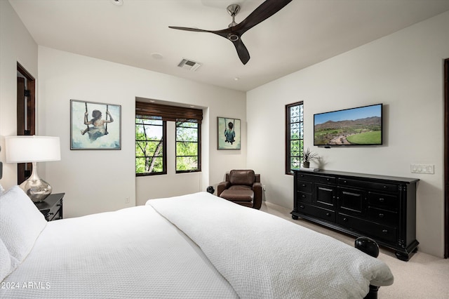 carpeted bedroom with ceiling fan