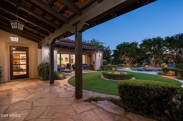 patio terrace at dusk with a yard