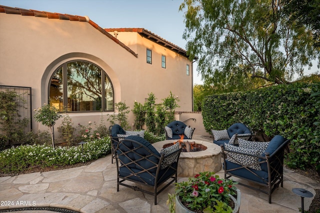 view of patio / terrace with a fire pit