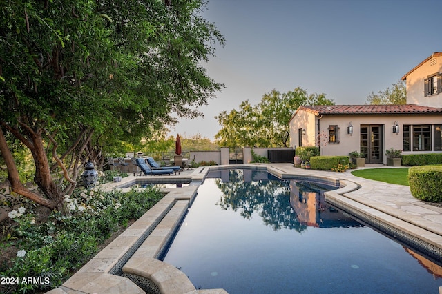 view of pool featuring a patio area