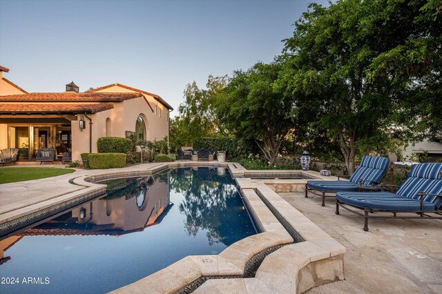 view of pool featuring a patio