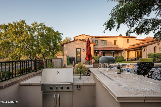 view of patio featuring exterior kitchen and area for grilling