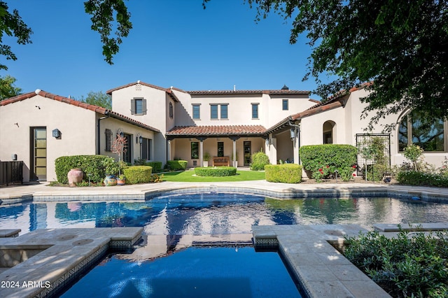 view of swimming pool with cooling unit and a patio