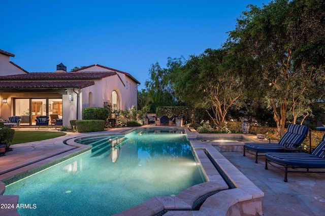 view of swimming pool with a patio