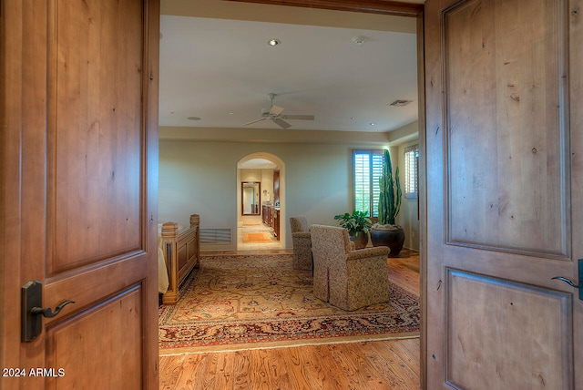 hallway with light hardwood / wood-style floors