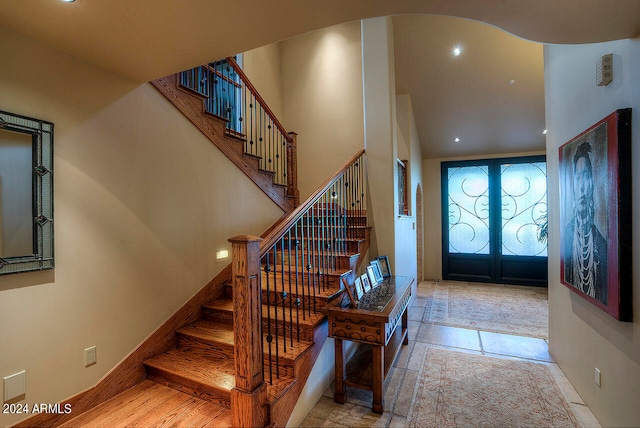 foyer entrance featuring french doors