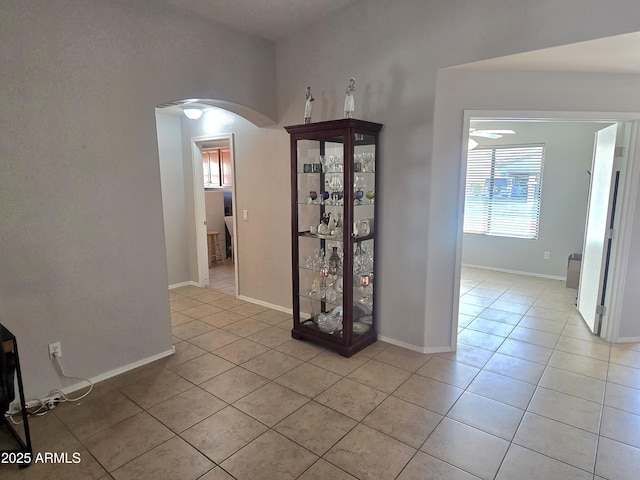 corridor featuring light tile patterned flooring