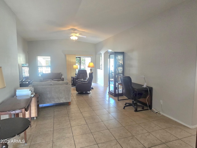 office area featuring light tile patterned flooring, lofted ceiling, and ceiling fan