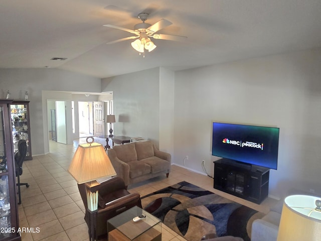 tiled living room featuring vaulted ceiling and ceiling fan