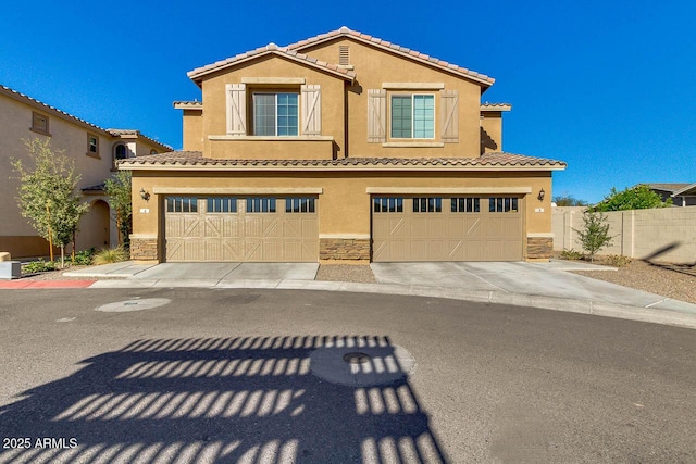 2254 E University Dr Unit 4, Mesa, AZ 85213 - view of front of home with stone siding, stucco siding, and a garage