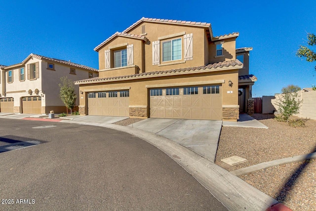 2254 E University Dr Unit 4, Mesa, AZ 85213 - view of front of property featuring an attached garage, stone siding, stucco siding, a tile roof, and concrete driveway