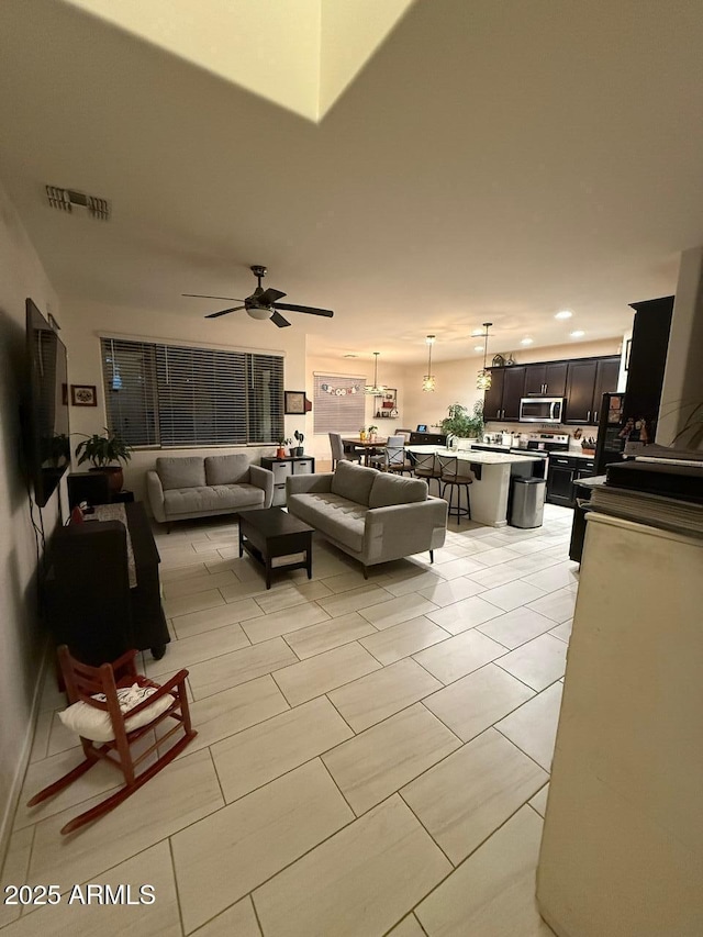 2254 E University Dr Unit 4, Mesa, AZ 85213 - living room with ceiling fan and recessed lighting