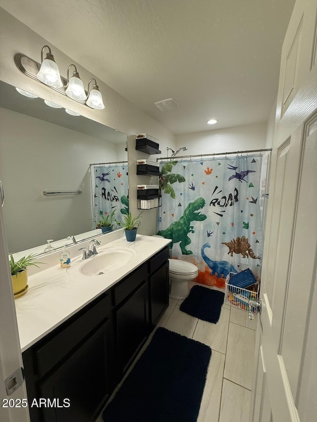 2254 E University Dr Unit 4, Mesa, AZ 85213 - full bath featuring vanity, curtained shower, tile patterned flooring, and recessed lighting
