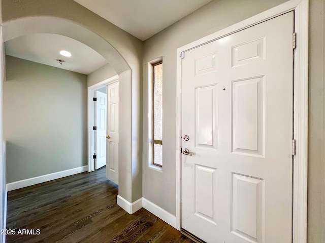 foyer entrance featuring dark hardwood / wood-style floors