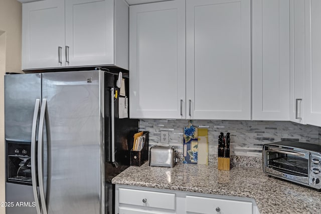 16624 E Palisades Blvd Unit 101, Fountain Hills, AZ 85268 - kitchen featuring white cabinets, tasteful backsplash, stainless steel refrigerator with ice dispenser, and a toaster