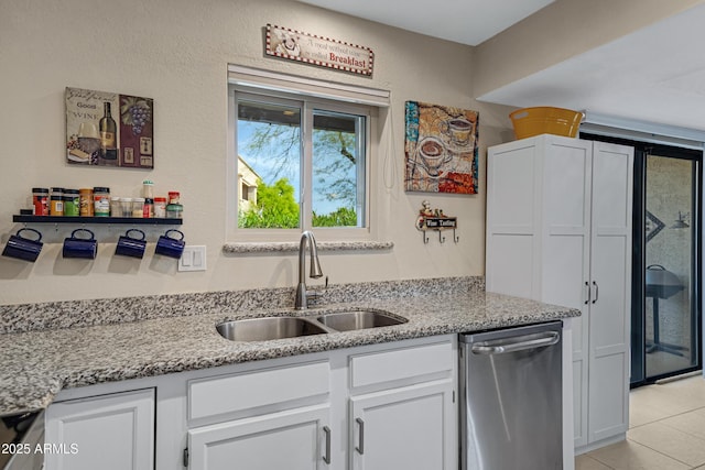 16624 E Palisades Blvd Unit 101, Fountain Hills, AZ 85268 - kitchen featuring dishwasher, a sink, white cabinetry, and light stone counters