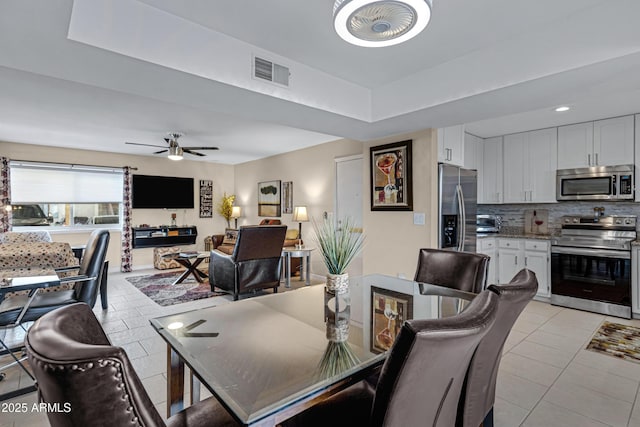 16624 E Palisades Blvd Unit 101, Fountain Hills, AZ 85268 - dining room featuring ceiling fan, visible vents, and light tile patterned floors