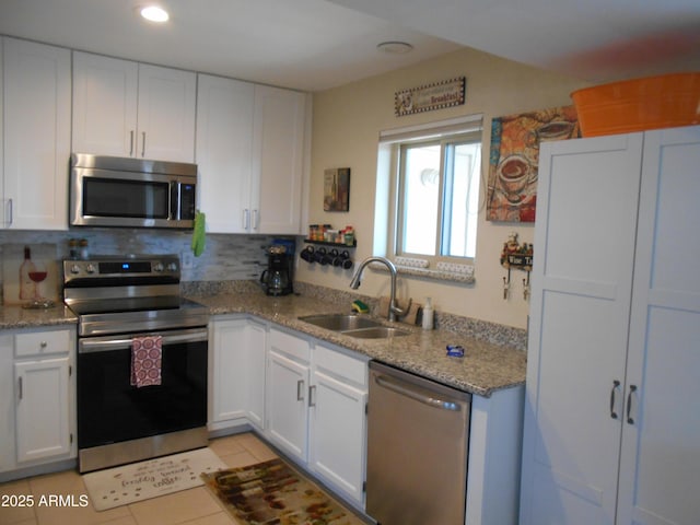 16624 E Palisades Blvd Unit 101, Fountain Hills, AZ 85268 - kitchen featuring recessed lighting, appliances with stainless steel finishes, white cabinetry, a sink, and backsplash