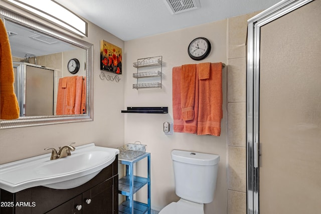 16624 E Palisades Blvd Unit 101, Fountain Hills, AZ 85268 - full bathroom featuring vanity, visible vents, toilet, and a shower stall