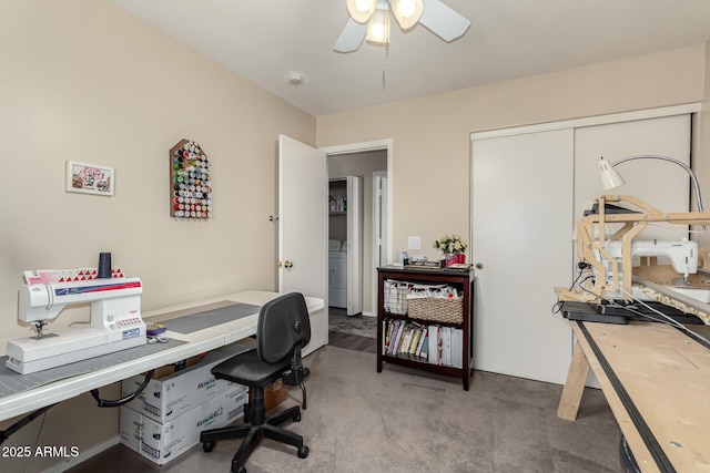 carpeted office with ceiling fan and washer / dryer