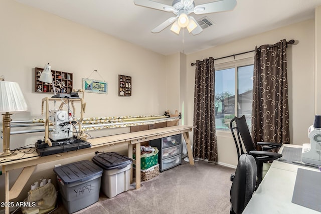 home office with ceiling fan and carpet flooring