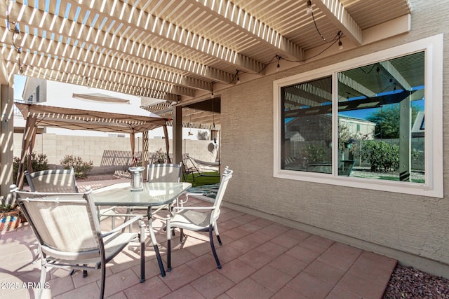 view of patio featuring a gazebo and a pergola