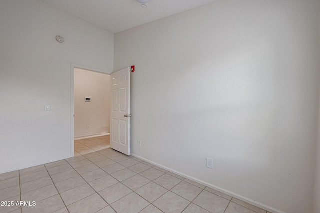 unfurnished room featuring light tile patterned floors