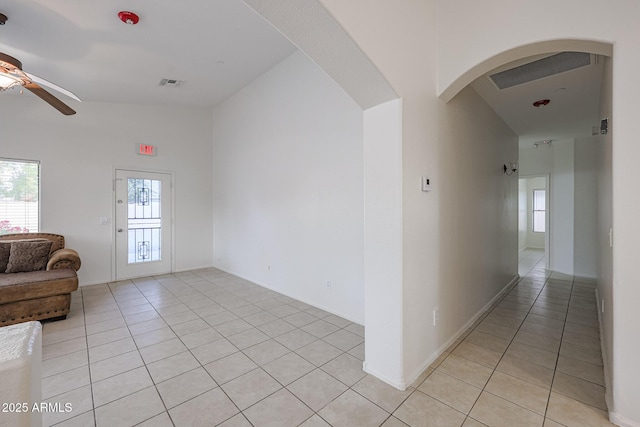 interior space with ceiling fan and light tile patterned flooring