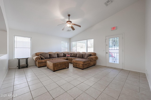 living room featuring ceiling fan, lofted ceiling, and light tile patterned flooring