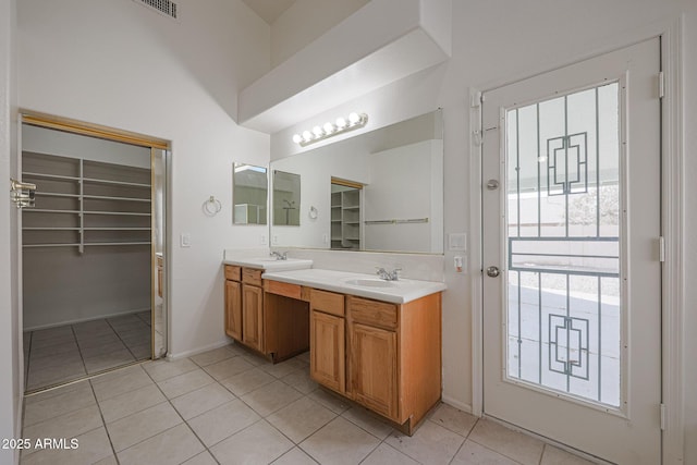 bathroom featuring vanity and tile patterned flooring