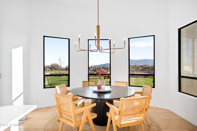 dining room with an inviting chandelier and a mountain view